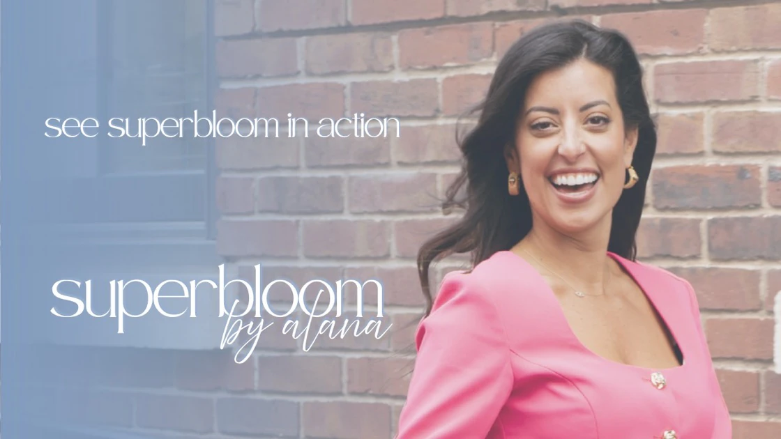 Alana Cummings laughing in a pink dress in front of a brick wall: preview of the Superbloom video.